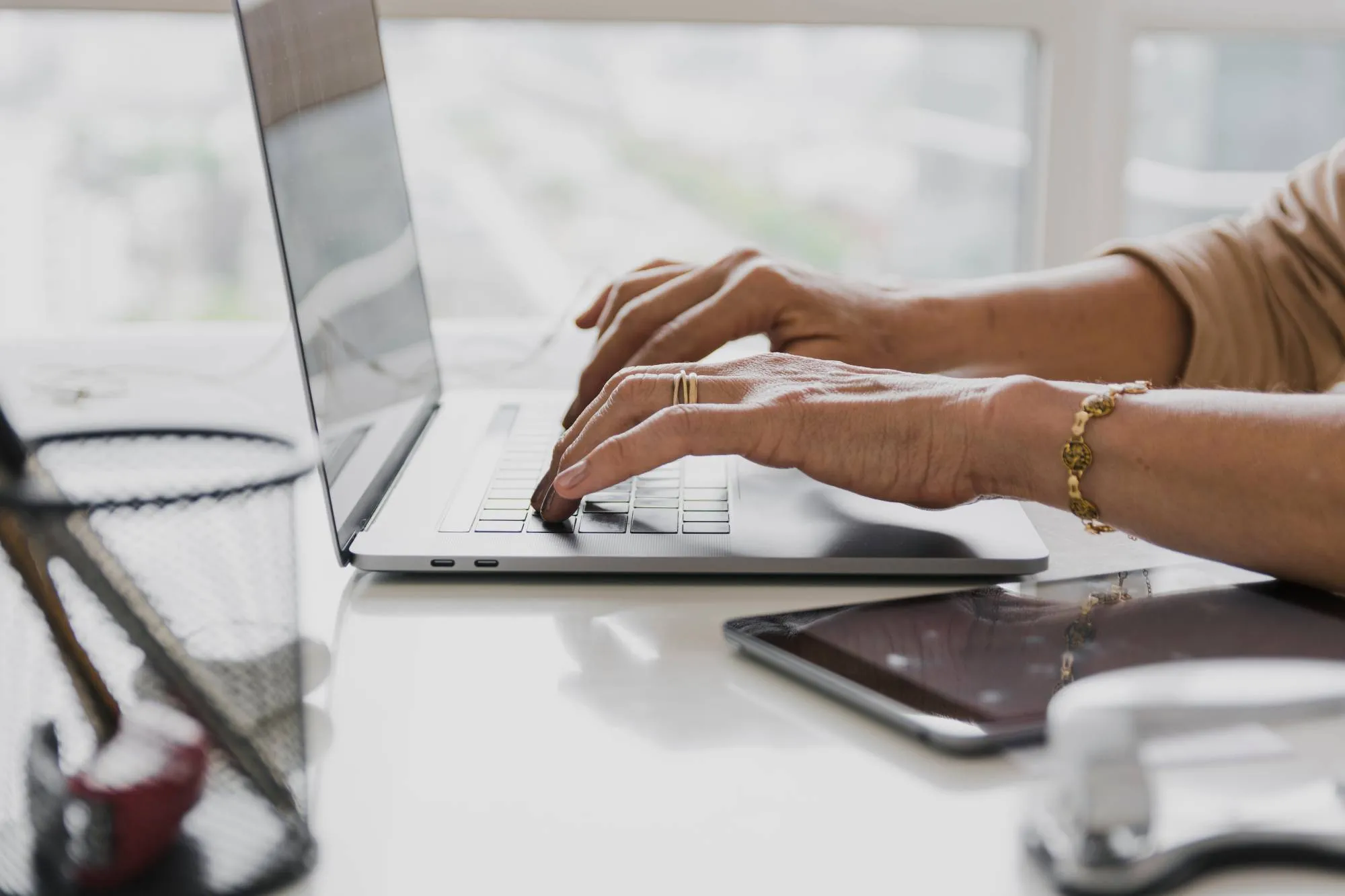 A hands working with the laptop.